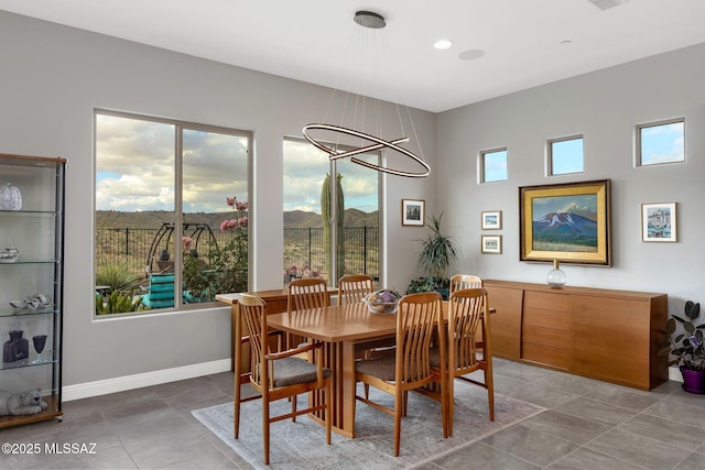 66450 E Sundance Pl, Saddlebrooke, AZ 85739 - dining area with baseboards and tile patterned floors