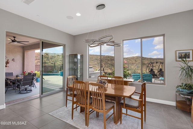 66450 E Sundance Pl, Saddlebrooke, AZ 85739 - dining space featuring plenty of natural light, tile patterned floors, baseboards, and a ceiling fan