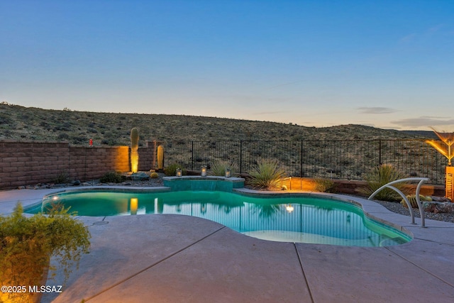 66450 E Sundance Pl, Saddlebrooke, AZ 85739 - pool at dusk featuring a fenced backyard and a patio area