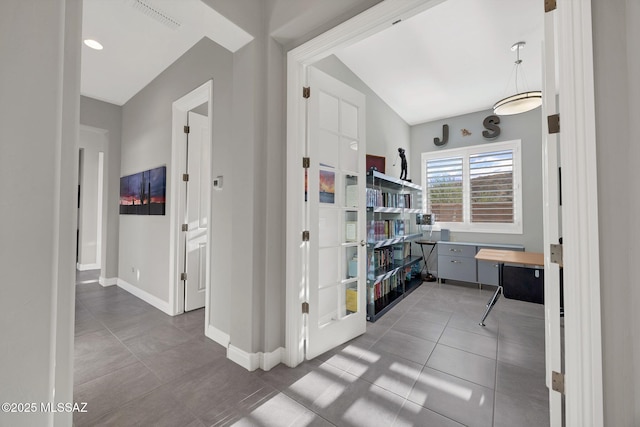 66450 E Sundance Pl, Saddlebrooke, AZ 85739 - hall with tile patterned flooring, baseboards, and lofted ceiling