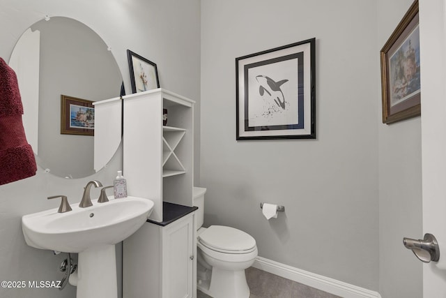 66450 E Sundance Pl, Saddlebrooke, AZ 85739 - half bathroom featuring toilet, baseboards, and tile patterned floors