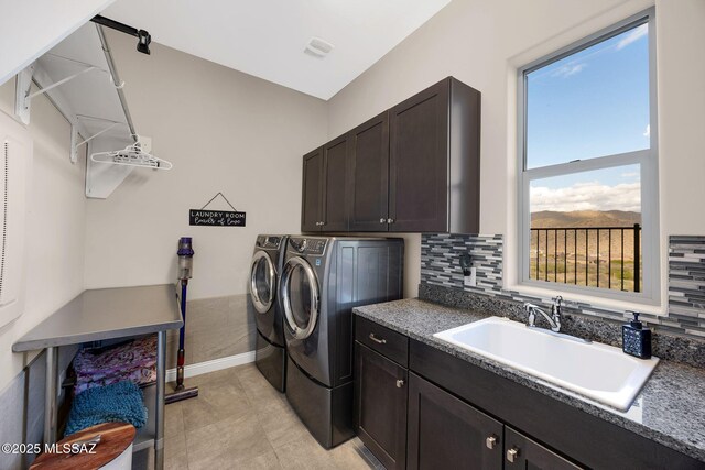 66450 E Sundance Pl, Saddlebrooke, AZ 85739 - laundry room with washer and clothes dryer, cabinet space, and light tile patterned floors