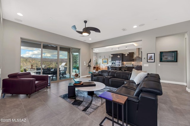 66450 E Sundance Pl, Saddlebrooke, AZ 85739 - living room with ceiling fan, baseboards, tile patterned flooring, and recessed lighting