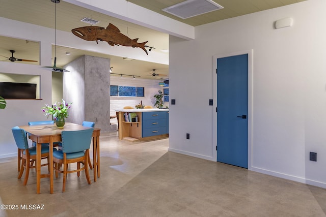 6714 E Topke St, Tucson, AZ 85715 - dining room with a ceiling fan, baseboards, and concrete flooring