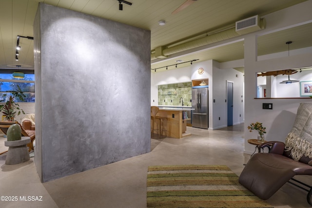 6714 E Topke St, Tucson, AZ 85715 - living room featuring finished concrete floors and track lighting