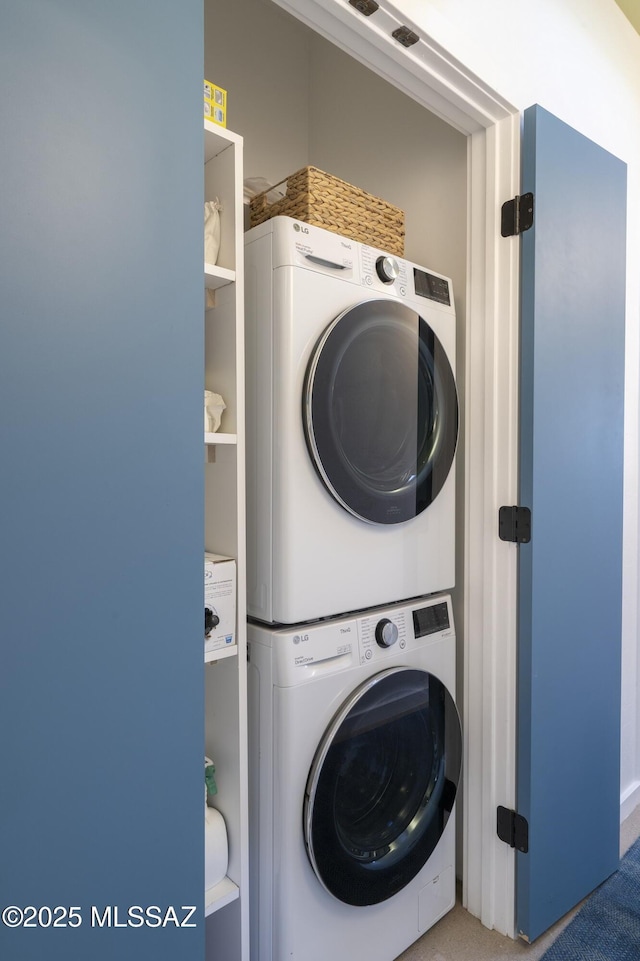 6714 E Topke St, Tucson, AZ 85715 - clothes washing area with stacked washing machine and dryer and carpet floors