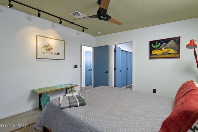 6714 E Topke St, Tucson, AZ 85715 - bedroom with track lighting, carpet, and ceiling fan
