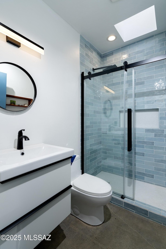 6714 E Topke St, Tucson, AZ 85715 - full bathroom featuring vanity, a stall shower, toilet, and a skylight