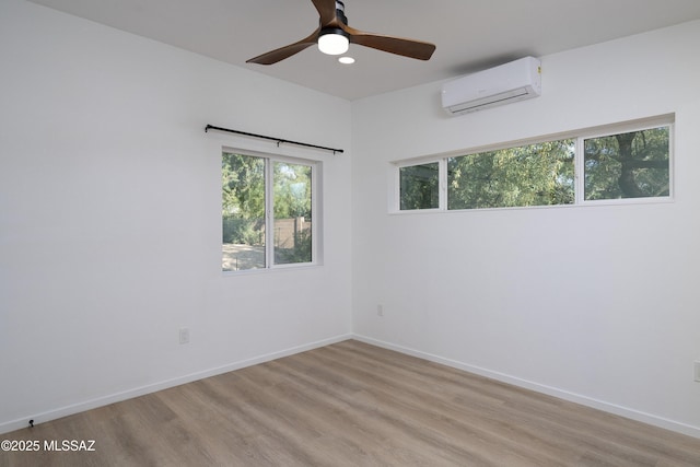 6714 E Topke St, Tucson, AZ 85715 - spare room with a wall mounted AC, light wood-type flooring, recessed lighting, and baseboards