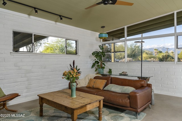 6714 E Topke St, Tucson, AZ 85715 - sunroom / solarium featuring rail lighting and plenty of natural light