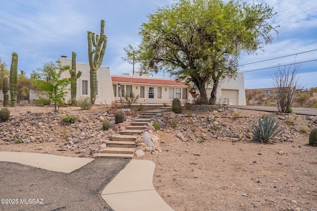 3531 W Goret Rd, Tucson, AZ 85745 - view of front of property with stucco siding, a tile roof, and a garage