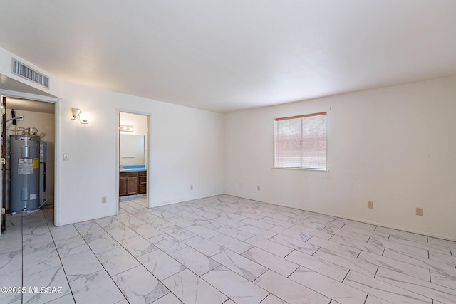 3531 W Goret Rd, Tucson, AZ 85745 - unfurnished living room with electric water heater and light marble finish flooring
