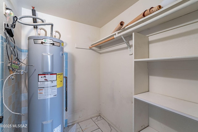 3531 W Goret Rd, Tucson, AZ 85745 - walk in closet with water heater and light marble finish flooring
