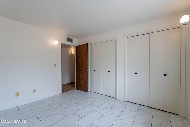 3531 W Goret Rd, Tucson, AZ 85745 - unfurnished bedroom with two closets