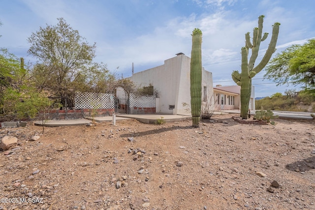 3531 W Goret Rd, Tucson, AZ 85745 - view of home's exterior with stucco siding and a patio
