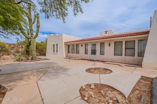 3531 W Goret Rd, Tucson, AZ 85745 - back of property featuring a tile roof, stucco siding, and a patio