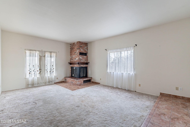 3531 W Goret Rd, Tucson, AZ 85745 - unfurnished living room with healthy amount of natural light, a fireplace, and carpet flooring