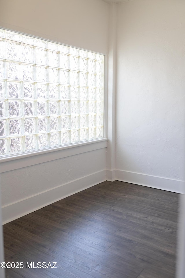 616 E 8th St, Tucson, AZ 85705 - empty room featuring baseboards and dark wood-style flooring