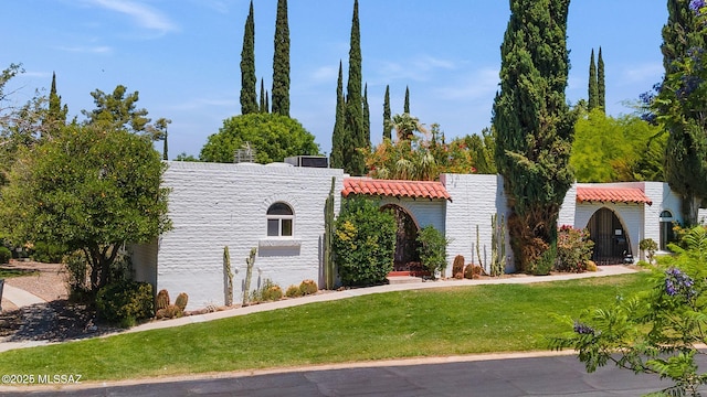 708 W Roller Coaster Rd, Tucson, AZ 85704 - view of front of property with a front yard and a tile roof