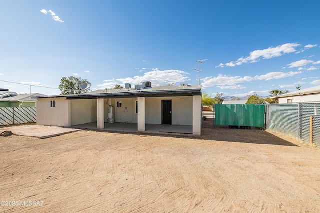 back of house featuring fence and a patio