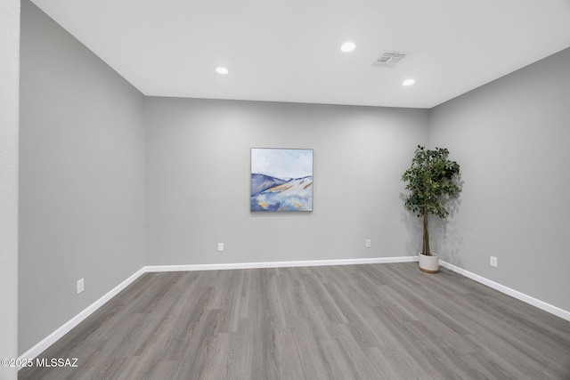 63370 E Whispering Tree Ln, Saddlebrooke, AZ 85739 - empty room featuring wood finished floors, recessed lighting, and baseboards