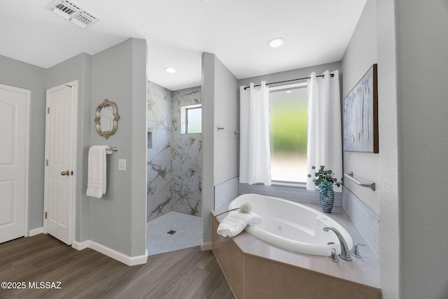 63370 E Whispering Tree Ln, Saddlebrooke, AZ 85739 - full bath featuring a tub with jets, a marble finish shower, wood finished floors, and baseboards