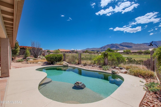 36359 S Wind Crest Dr, Saddlebrooke, AZ 85739 - view of swimming pool with a mountain view, a fenced backyard, and a patio area