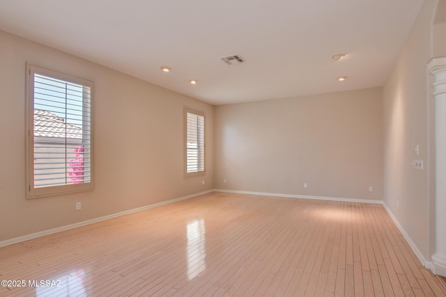 36359 S Wind Crest Dr, Saddlebrooke, AZ 85739 - spare room with light wood-type flooring, baseboards, and recessed lighting