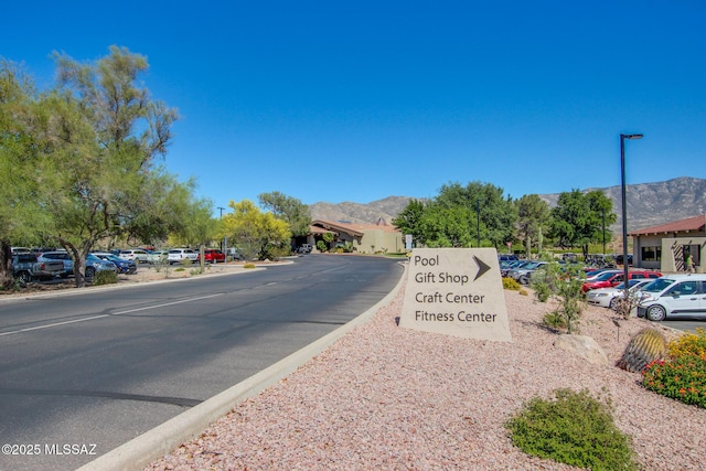 36359 S Wind Crest Dr, Saddlebrooke, AZ 85739 - view of asphalt street with a mountain view and street lights
