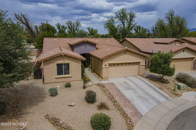 825 E Gunsight Mountain Pl, Sahuarita, AZ 85629 - view of front facade with driveway, a garage, stucco siding, and a tiled roof