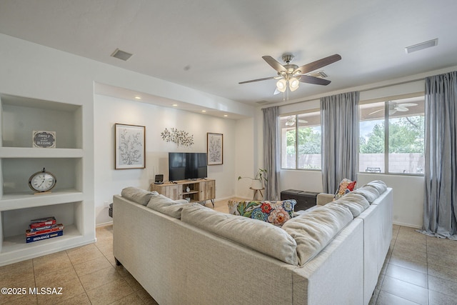 825 E Gunsight Mountain Pl, Sahuarita, AZ 85629 - living room featuring built in shelves, light tile patterned floors, a ceiling fan, baseboards, and recessed lighting