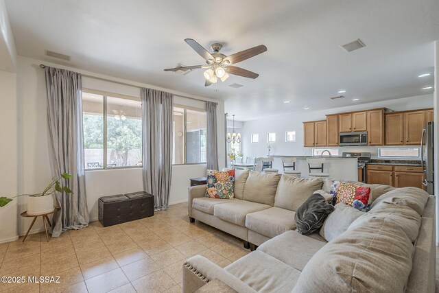 825 E Gunsight Mountain Pl, Sahuarita, AZ 85629 - living area with a ceiling fan, light tile patterned floors, a chandelier, baseboards, and recessed lighting