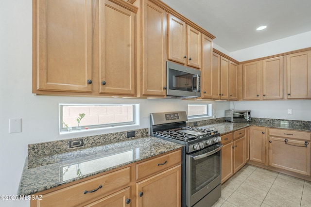 825 E Gunsight Mountain Pl, Sahuarita, AZ 85629 - kitchen featuring stainless steel appliances, stone counters, plenty of natural light, light tile patterned flooring, and recessed lighting