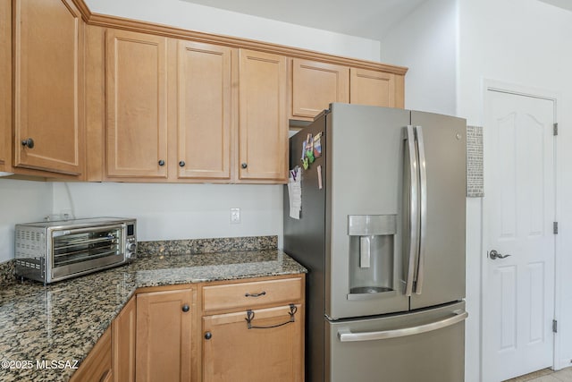 825 E Gunsight Mountain Pl, Sahuarita, AZ 85629 - kitchen with stainless steel fridge with ice dispenser and dark stone counters