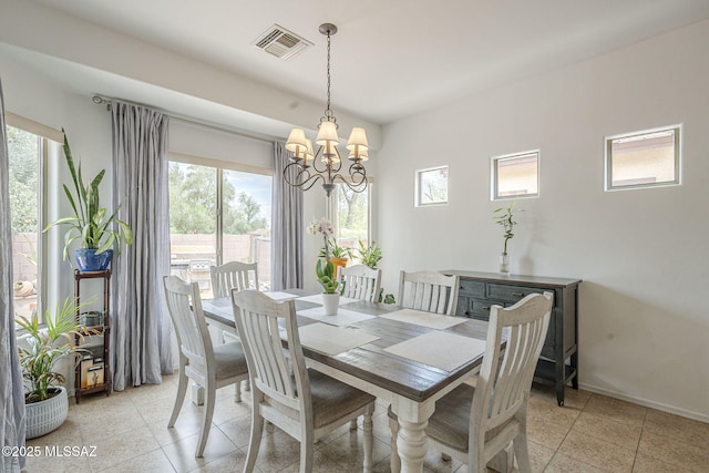 825 E Gunsight Mountain Pl, Sahuarita, AZ 85629 - dining space with a chandelier, healthy amount of natural light, baseboards, and light tile patterned floors