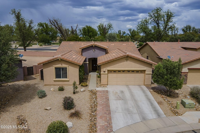 825 E Gunsight Mountain Pl, Sahuarita, AZ 85629 - view of front of home featuring a garage, concrete driveway, stucco siding, a tiled roof, and fence