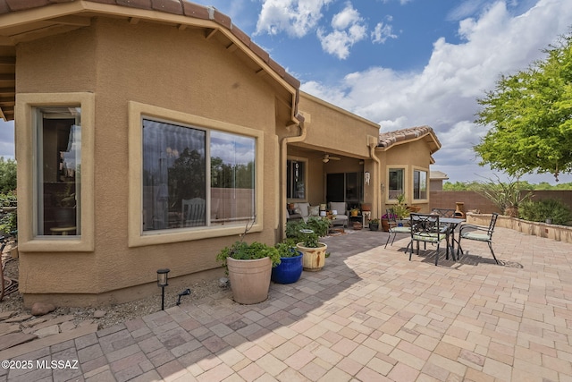 825 E Gunsight Mountain Pl, Sahuarita, AZ 85629 - view of patio / terrace featuring fence, outdoor dining space, and ceiling fan