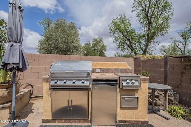 825 E Gunsight Mountain Pl, Sahuarita, AZ 85629 - view of patio / terrace featuring exterior kitchen, grilling area, and fence