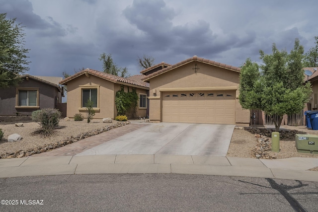 825 E Gunsight Mountain Pl, Sahuarita, AZ 85629 - mediterranean / spanish-style house featuring driveway, a garage, stucco siding, and a tile roof