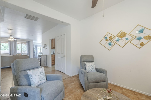 825 E Gunsight Mountain Pl, Sahuarita, AZ 85629 - living room featuring ceiling fan, baseboards, and light tile patterned floors