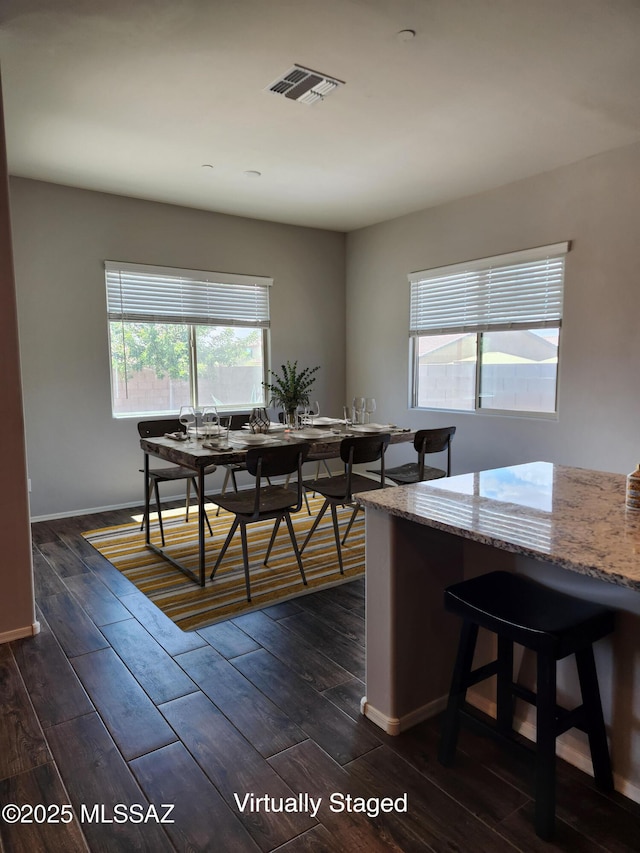 12493 N Blondin Dr, Marana, AZ 85653 - dining space with baseboards and dark wood-style floors