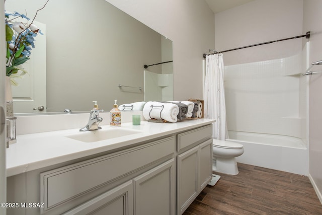12493 N Blondin Dr, Marana, AZ 85653 - bathroom featuring wood finished floors, vanity, toilet, and shower / bath combo with shower curtain