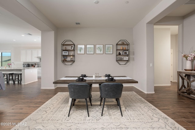 12493 N Blondin Dr, Marana, AZ 85653 - dining space featuring dark wood finished floors, baseboards, and recessed lighting