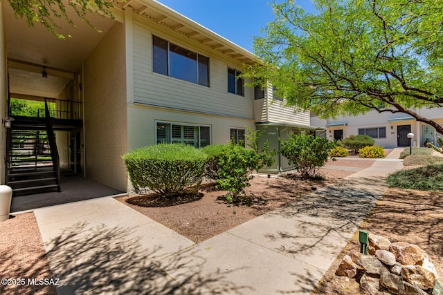 8150 E Broadway Blvd Unit H-107, Tucson, AZ 85710 - view of front facade with stairs