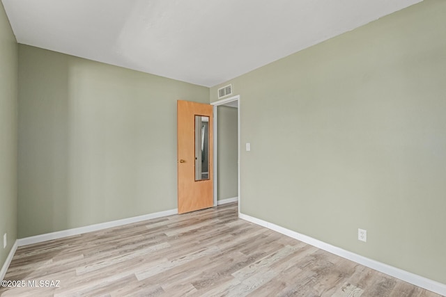 8150 E Broadway Blvd Unit H-107, Tucson, AZ 85710 - spare room with light wood-type flooring and baseboards