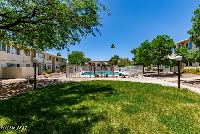 8150 E Broadway Blvd Unit H-107, Tucson, AZ 85710 - view of yard with a community pool