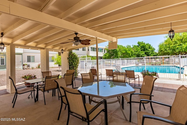 8150 E Broadway Blvd Unit H-107, Tucson, AZ 85710 - view of patio featuring outdoor dining area and ceiling fan