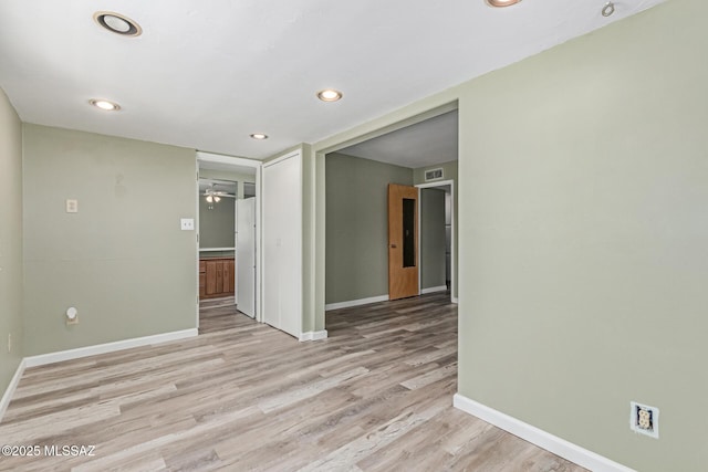 8150 E Broadway Blvd Unit H-107, Tucson, AZ 85710 - empty room with baseboards, light wood finished floors, a ceiling fan, and recessed lighting