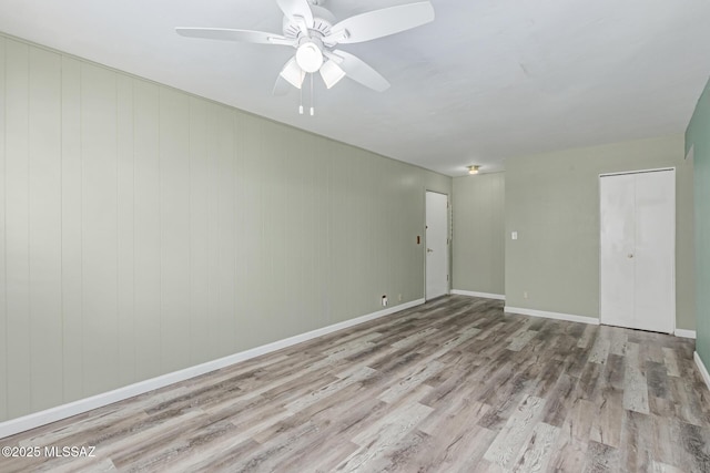 8150 E Broadway Blvd Unit H-107, Tucson, AZ 85710 - unfurnished room featuring wood finished floors, ceiling fan, and baseboards