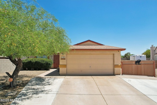 1861 W Sauvignon Dr, Tucson, AZ 85746 - view of front of house featuring stucco siding, driveway, an attached garage, and fence